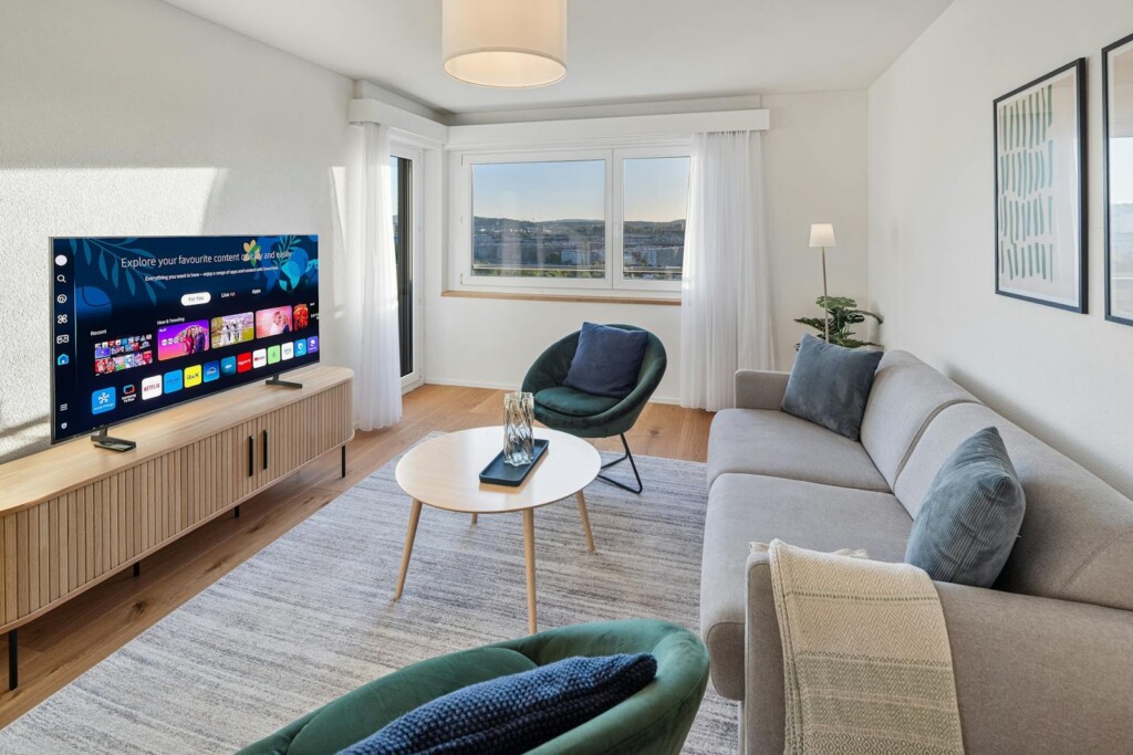 Penthouse living room with panoramic window at STAYY On Top Penthouse in Opfikon